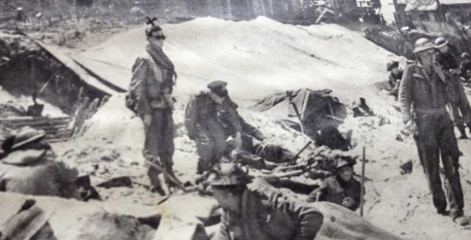 The guy with the X in the picture is my Grandad. It's from an old photobook about the Normandy landings on D-Day.