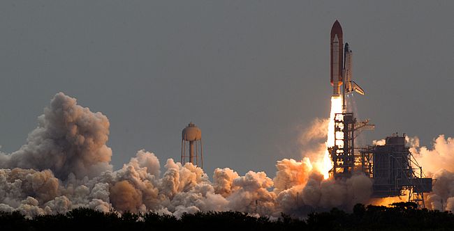 The Space Shuttle Atlantis launching from Cape Canaveral, Florida